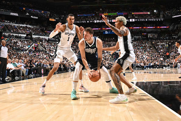 Dallas Mavericks superstar Luka Doncic gets trapped by San Antonio Spurs' Victor Wembanyama and Jeremy Sochan.